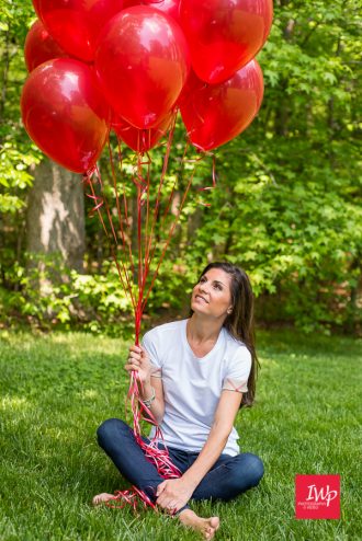 A picture of Jennifer with red ballons